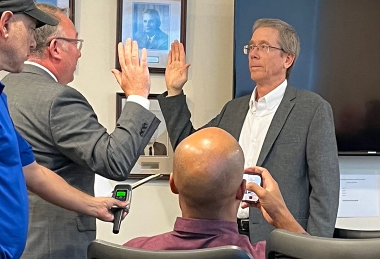 Tom Domonoske is being sworn in