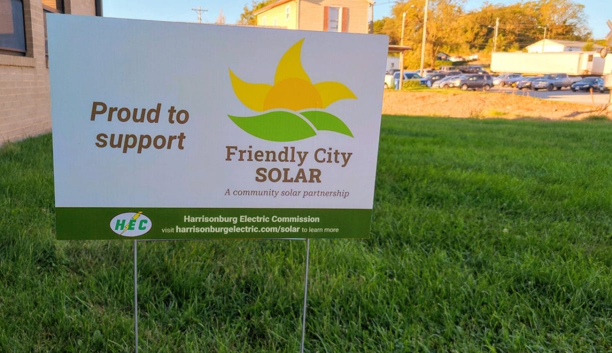 A picture of a yard sign advertising the Friendly City Solar program