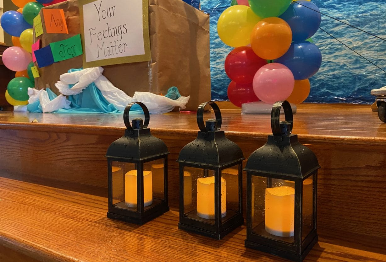 Lanterns sit on a stage as symbols