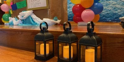 Lanterns sit on a stage as symbols