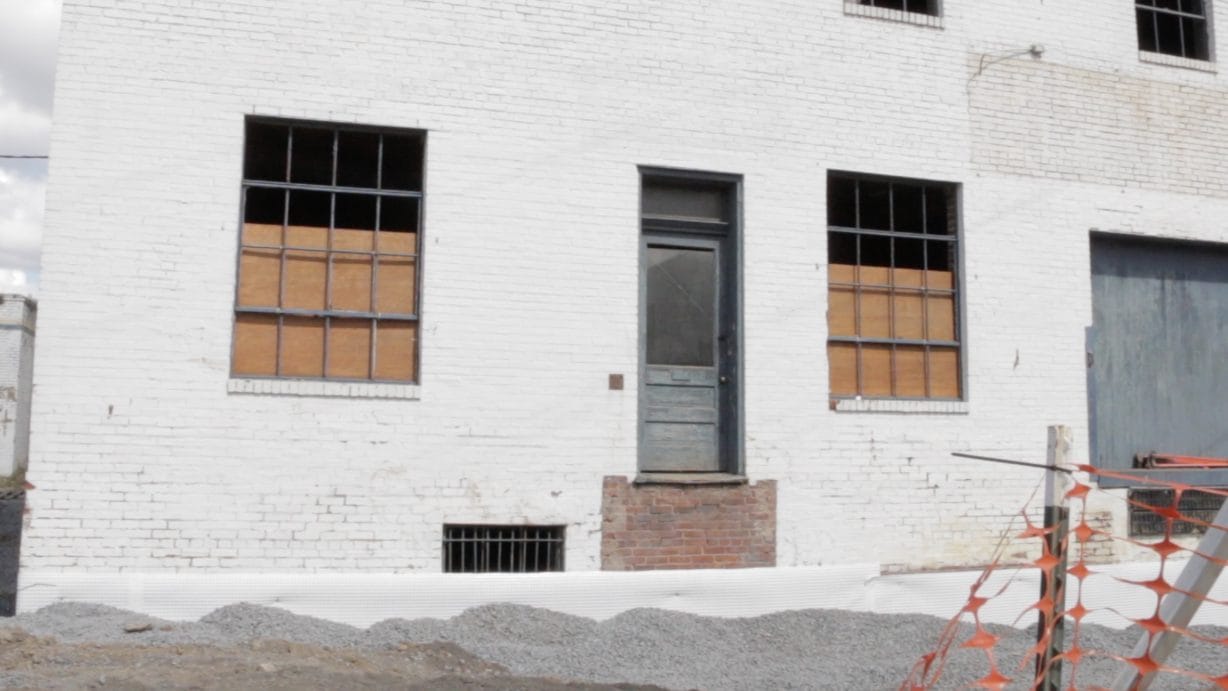 A building with boarded up windows