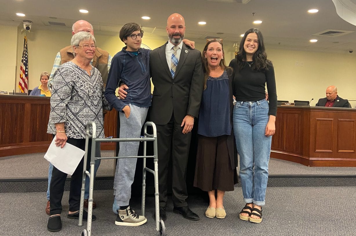 A family in the council chambers