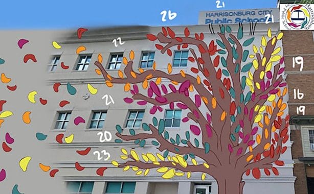 A painting of a tree on the side of a building with painted leaves. 