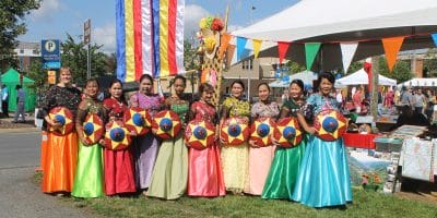 People in colorful dresses stand together