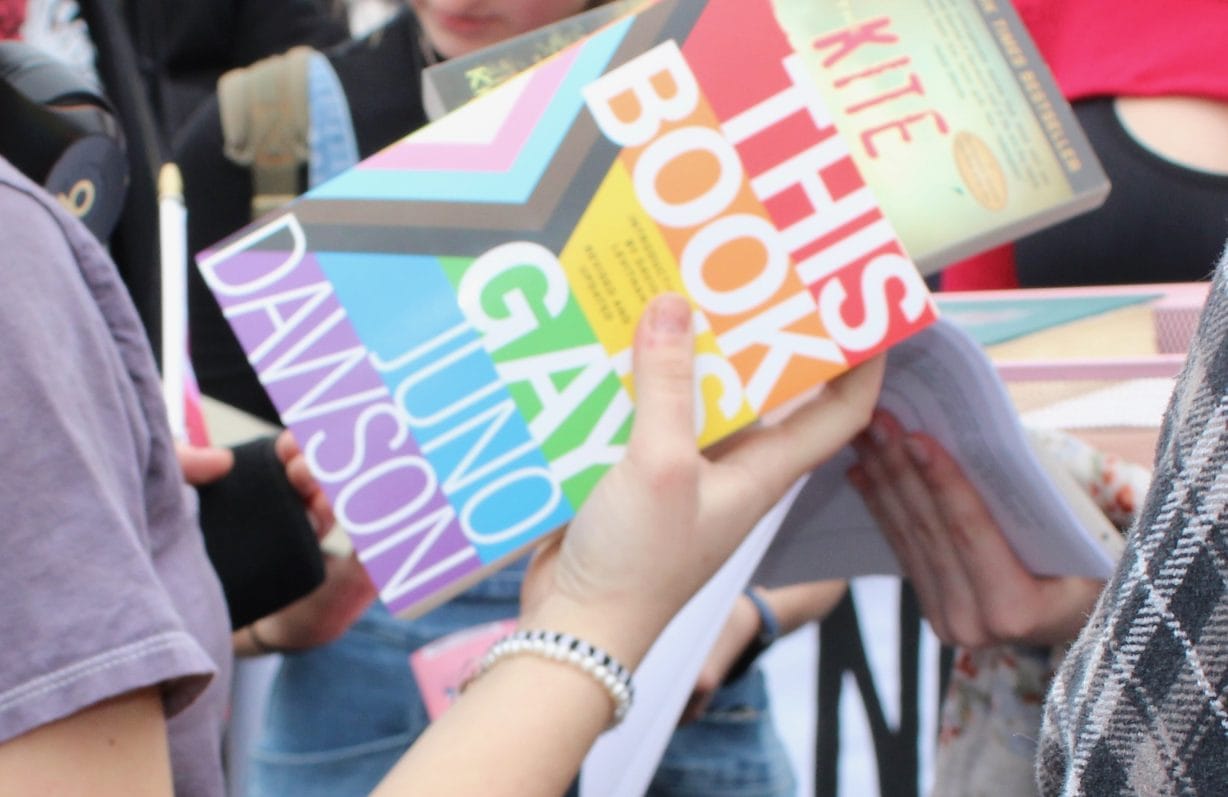 A colorful book held in someone's hands