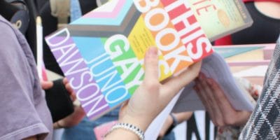 A colorful book held in someone's hands