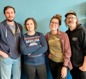 Four people smiling