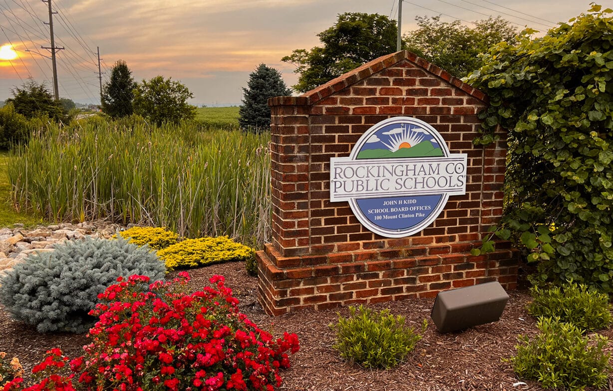 The Rockingham Count School District headquarters sign at sunset
