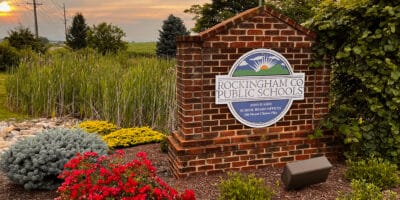 The Rockingham Count School District headquarters sign at sunset