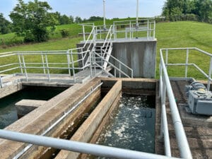 concrete vats of water connected by a catwalk