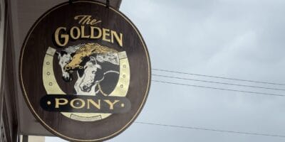 The Golden Pony's sign hanging above its doors