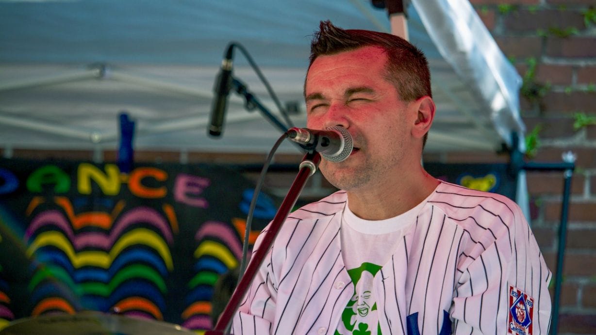 A man singing into a microphone